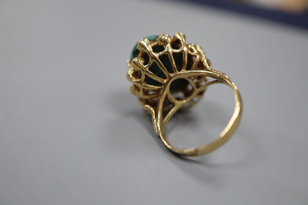 A continental yellow metal and malachite? set dress ring, size N, gross 8.7 grams.